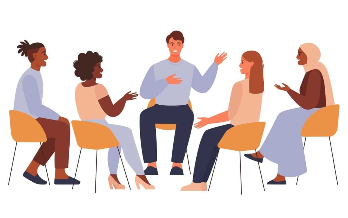 Group of four professionals engaged in collaborative training session